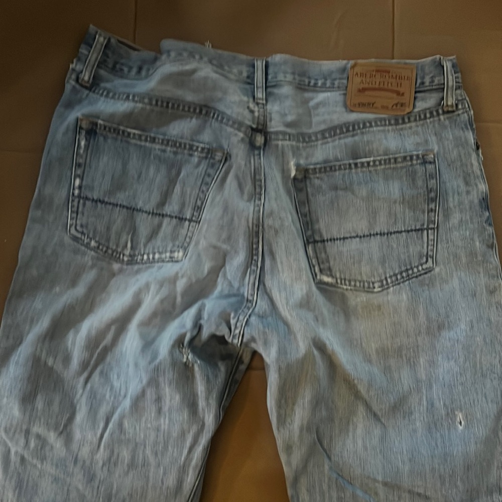 Levi jeans faded color 36 waist 32 l got holes in them abercrombie and fitch